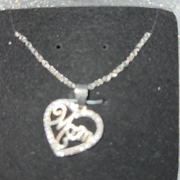 Cute little mom necklace. Silver with diamonds and mom designed in cursive. - Picture 2 of 3